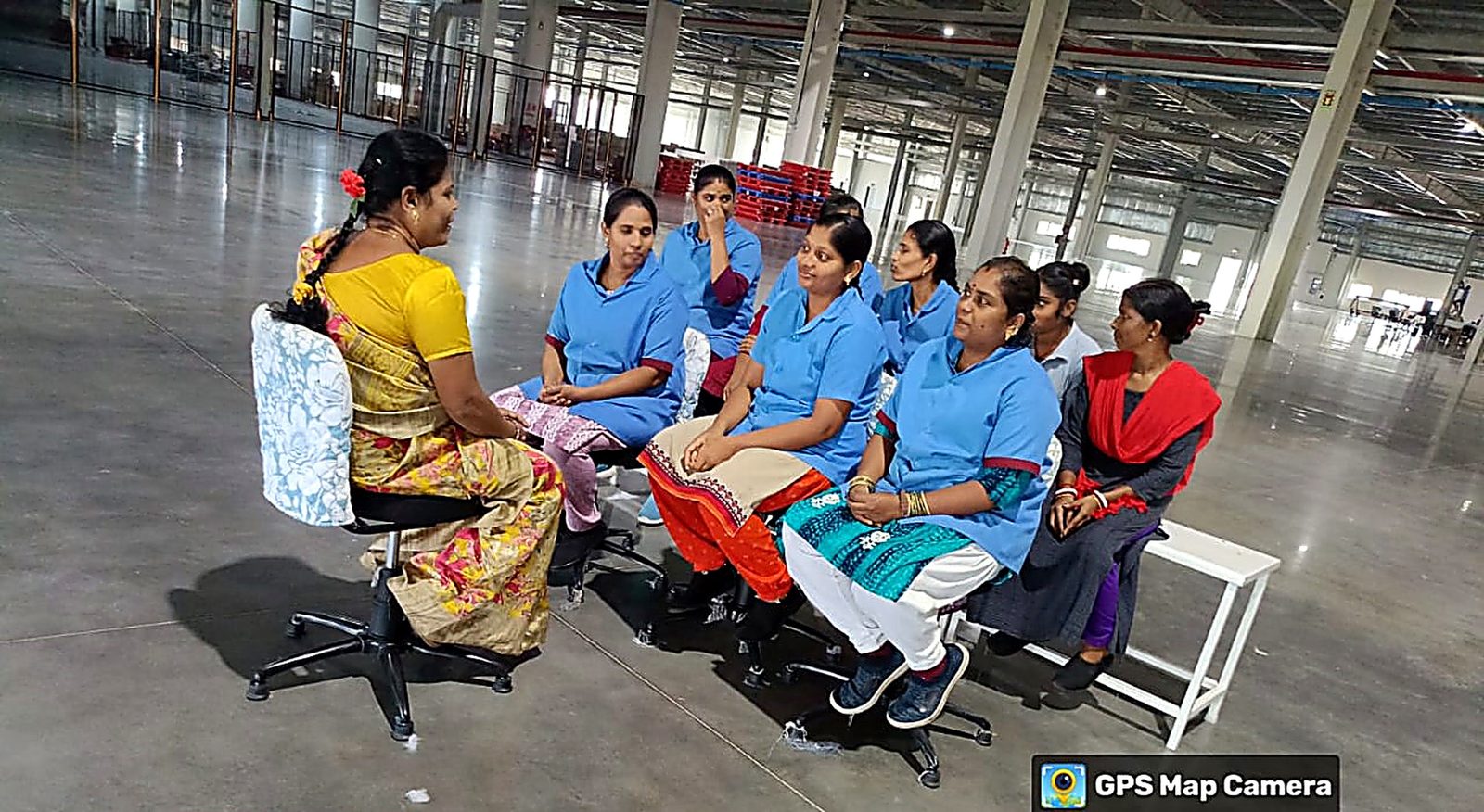 An NMCT Internal Committee session with women employees on a factory floor
